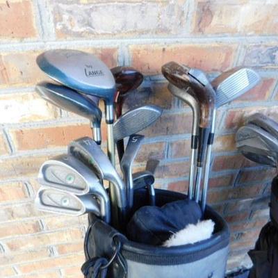 Two Sets of Gold Clubs and Bags