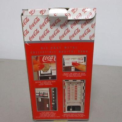 Lot 20 - Coca Cola Die Cast Vending Machine Musical Bank