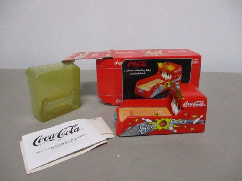 Lot 30 - Coca-Cola Musical Bowling Alley Bank | EstateSales.org
