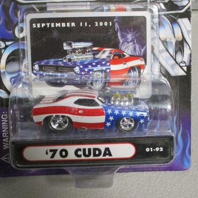 Lot 82 - Johnny Lightning - Muscle Machines Die Cast Cars