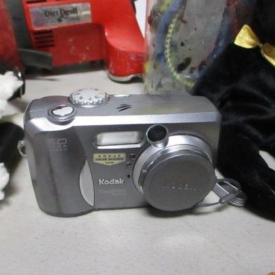 Lot 223 - Bushnell Binoculars - DVDs - Kodak Camera - Dirt Devil