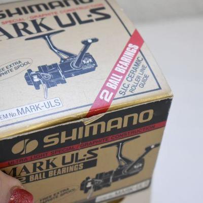 Lot B-117: Shimano Mark UL-S and Shakespeare Omni 035 Reels with Boxes