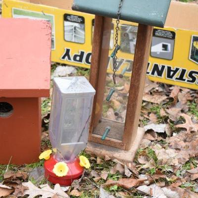 Lot O-23: Birdfeeder, Hummingbird feeder, and Bird House