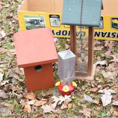 Lot O-23: Birdfeeder, Hummingbird feeder, and Bird House