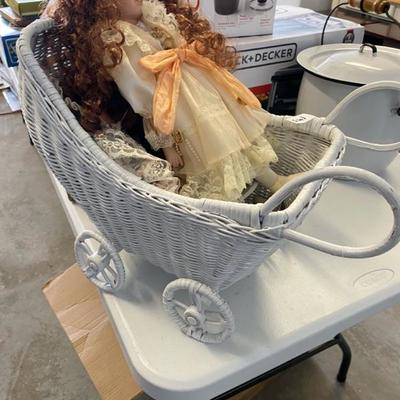 Lot 143 Porcelain dolls (3) in wicker carriage