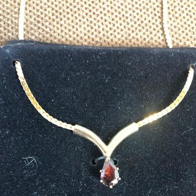 Lot # 160 Garnet on a gold tone chain 'ladies Costume Jewelry