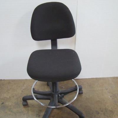 Lot 1051 - Simple Armless Black Office Chair on Wheels
