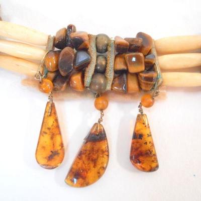 Lot 2055 - Bone and Amber choker with suede