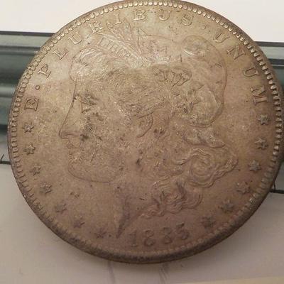 1885 Morgan silver dollar.