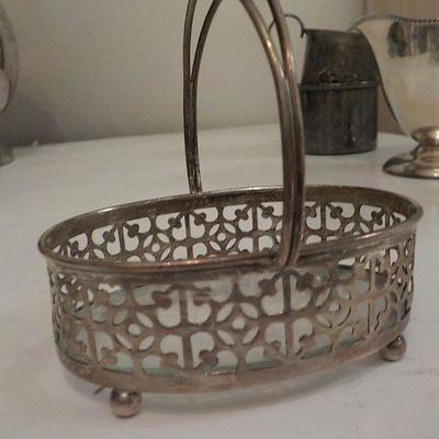 Sterling candy basket with glass bottom.