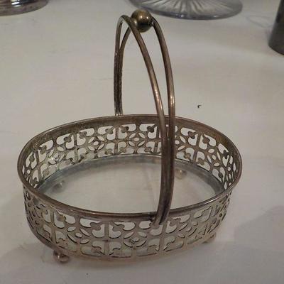 Sterling candy basket with glass bottom.