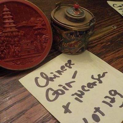 Chinese ming coin and incense .