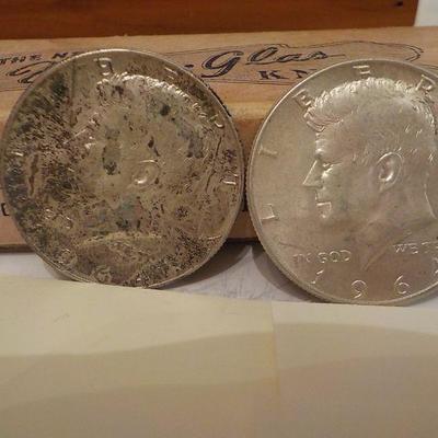 2 -1964 Kennedy half dollar coins.