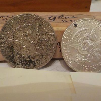 2 -1964 Kennedy half dollar coins.