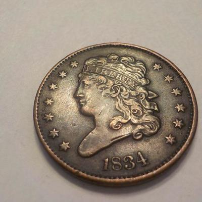 1834 Braided Half cent liberty coin.