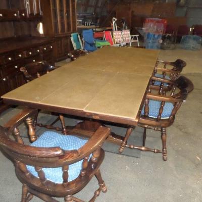 Ethan Allen Solid Pine table and 6 captain's chairs.
