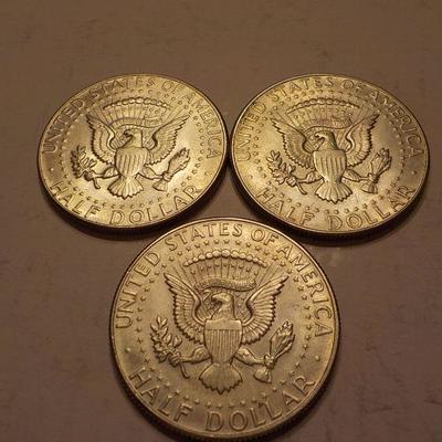 3- 1965 Kennedy Half dollar coins.
