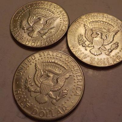 3- 1965 Kennedy Half dollar coins.