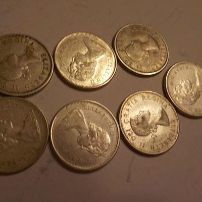 1965, 1960 Canadian quarters plus 2 centennial 1967 quarters.