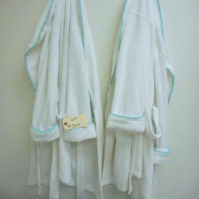 Lot 509 - 8 pc. Couture Wall Hangings, 2 Soft Robes & Blue Floor Rug