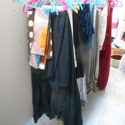 Lot 254 - Rolling Clothes Rack Full of Blankets + One Black Sheet