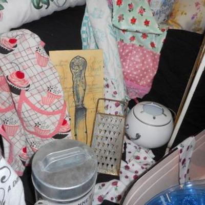 Lot 658 - Vintage Kitchen Aprons, Pink Metal Wash Bin, Cool Clock & More