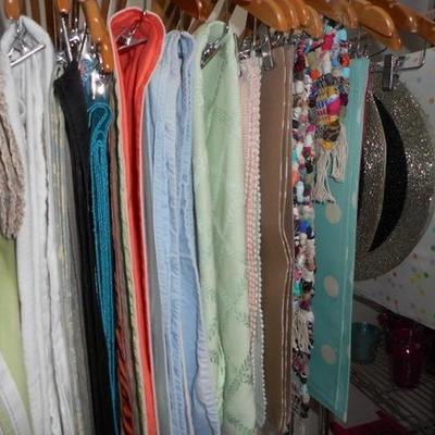 Lot 822 - Wide Assortment of Table Cloths  + Runners and Place Mats + Wheeled Rack 