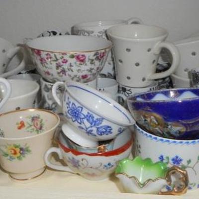 Lot 829 - Shelves Full of Glassware Lots of teacups 