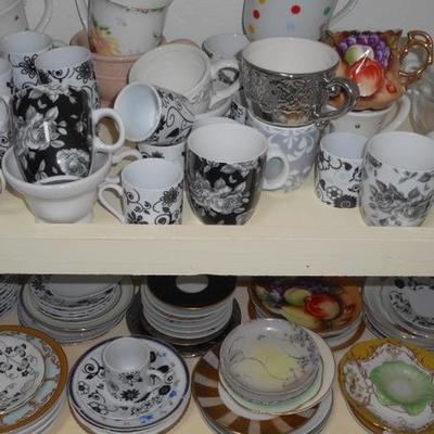 Lot 829 - Shelves Full of Glassware Lots of teacups 