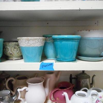 Lot 830 - Shelves Full of Glassware Teapots Planters Red Glass