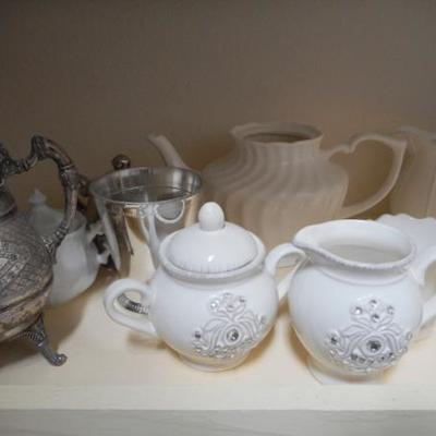 Lot 830 - Shelves Full of Glassware Teapots Planters Red Glass