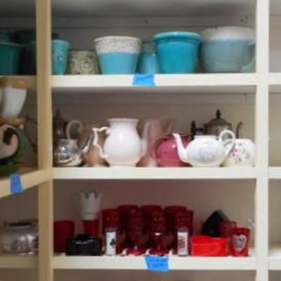 Lot 830 - Shelves Full of Glassware Teapots Planters Red Glass
