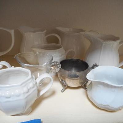 Lot 830 - Shelves Full of Glassware Teapots Planters Red Glass