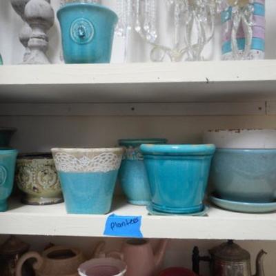 Lot 830 - Shelves Full of Glassware Teapots Planters Red Glass