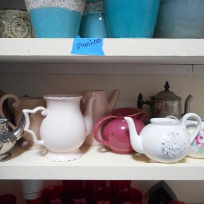Lot 830 - Shelves Full of Glassware Teapots Planters Red Glass