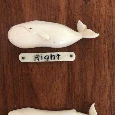 Aletha Macy Hand Carved Whale Figurines on Mahogany 