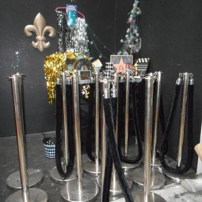 Lot 845 - 12 Stainless Steel Crowd Dividers + Hollywood Themed Items