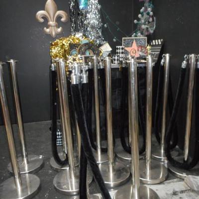 Lot 845 - 12 Stainless Steel Crowd Dividers + Hollywood Themed Items