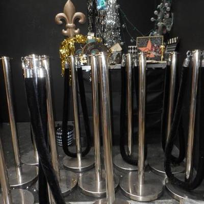 Lot 845 - 12 Stainless Steel Crowd Dividers + Hollywood Themed Items
