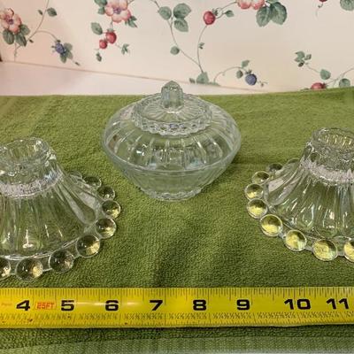 Glass candlesticks and bowl with lid 