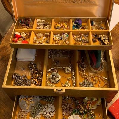 Jewelry box filled with costume jewelry 