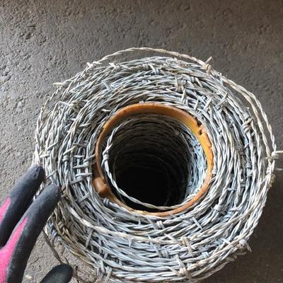 Spools of Chain and Barbed Wire