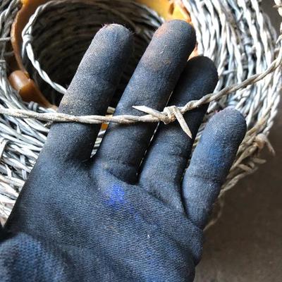 Spools of Chain and Barbed Wire