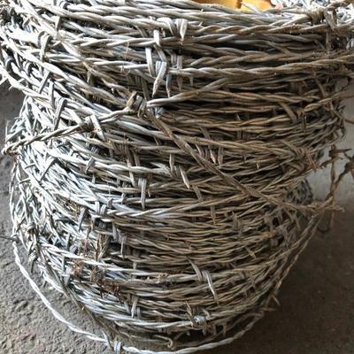 Spools of Chain and Barbed Wire