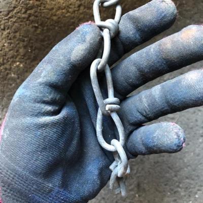 Spools of Chain and Barbed Wire