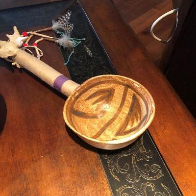 Clay bowl with feathers