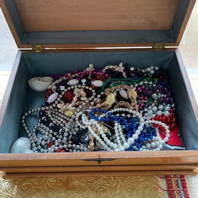 Jewelry box full of beaded necklaces