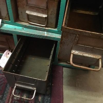 Lot 77  Pair of green rustic wood and metal shelves with drawers