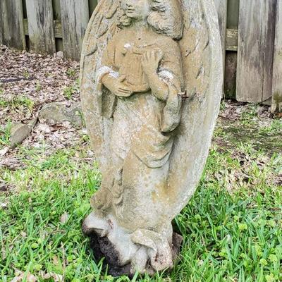 Concrete angel with small harp