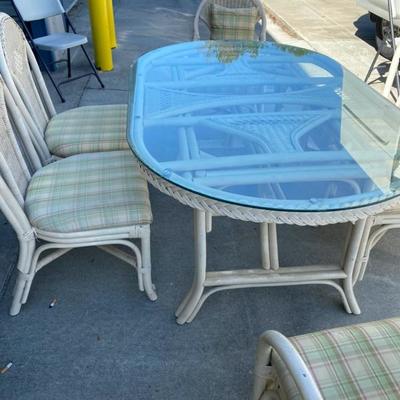 Wicker/Glass Table w/4 side chairs and 2 arm chairs with cushions-Lot 642